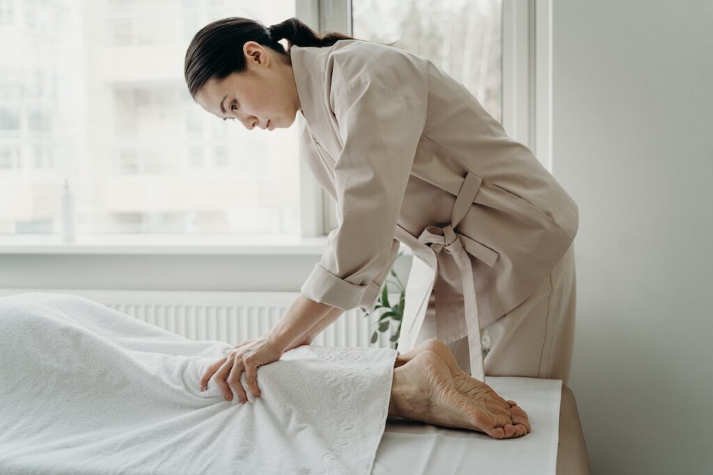 Woman showing how to become a massage therapist