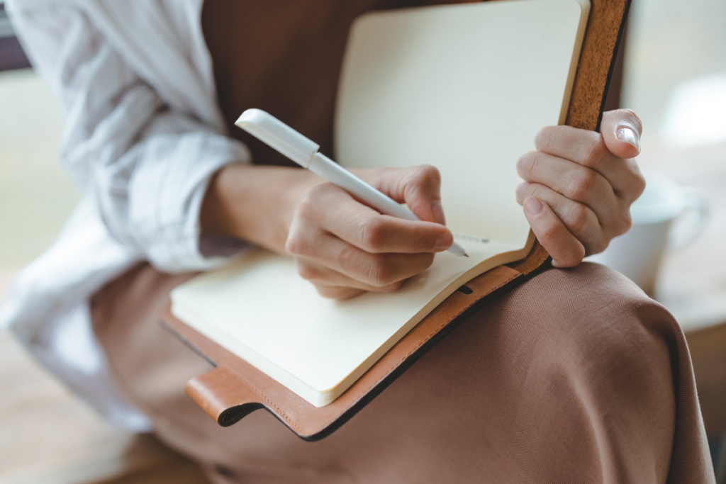 Writing in a journal as a way on how to practice gratitude